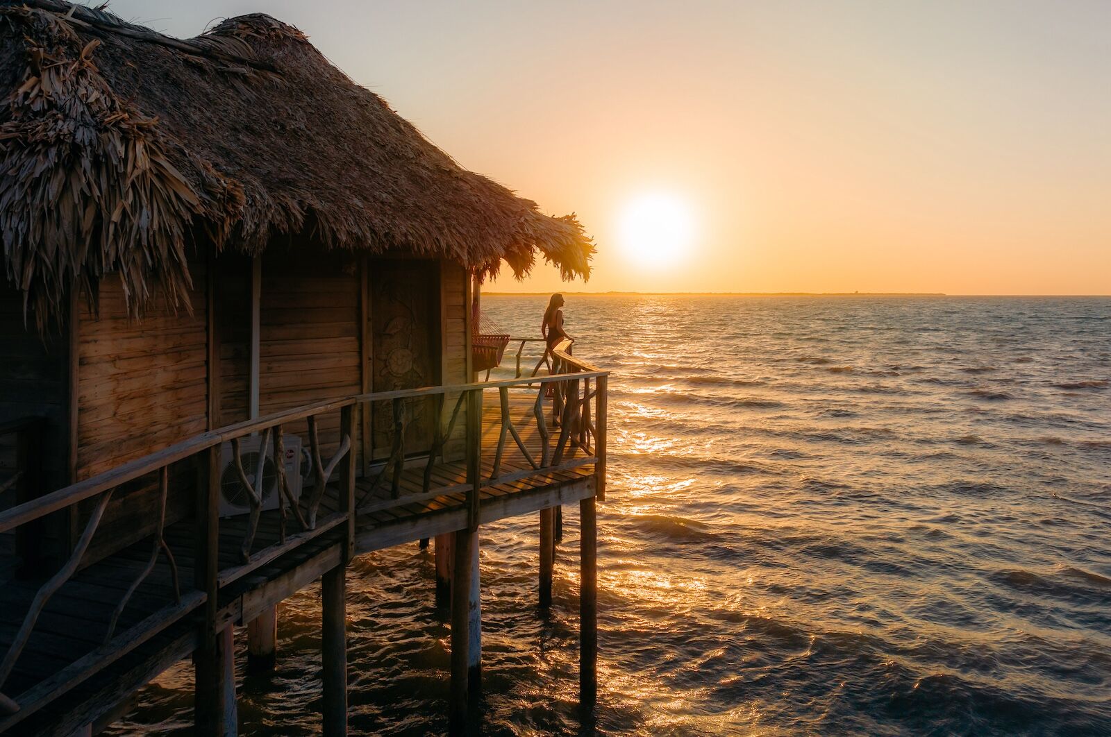 Thatch-Caye_Overwater-bungalow_sunrise