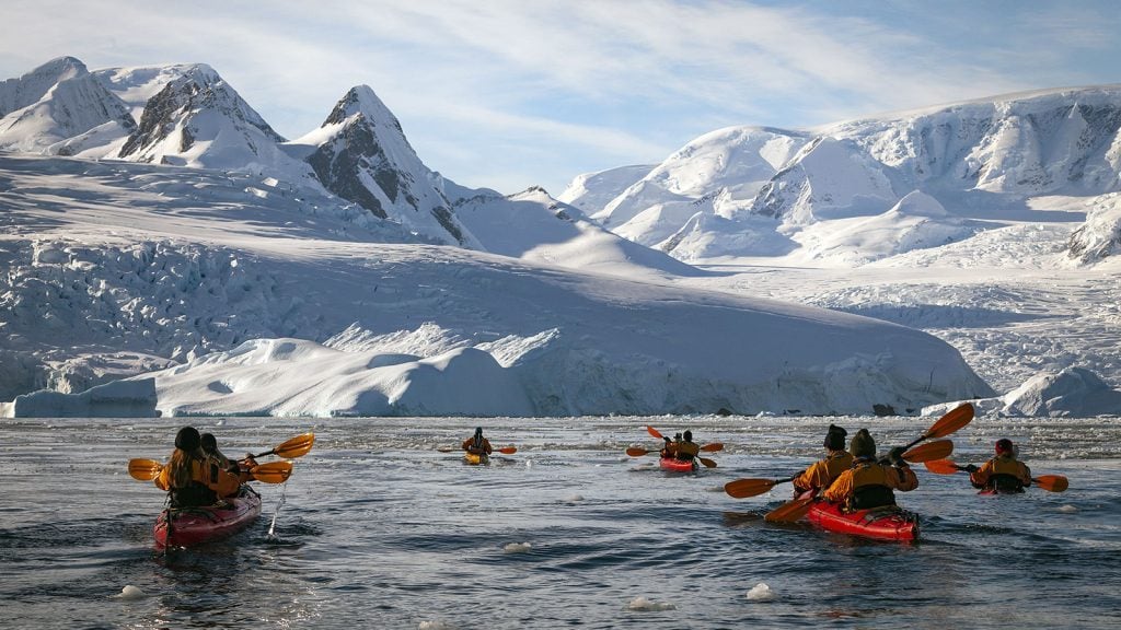 G-Adventures-Antarctica-Mountain-Range-Group-Kayaking-1024x576-1