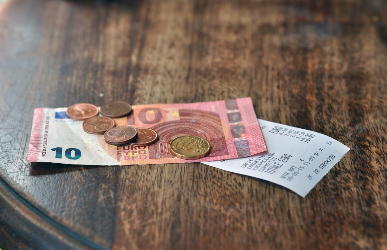 Money-and-a-check-on-the-table Money-and-a-check-on-the-table