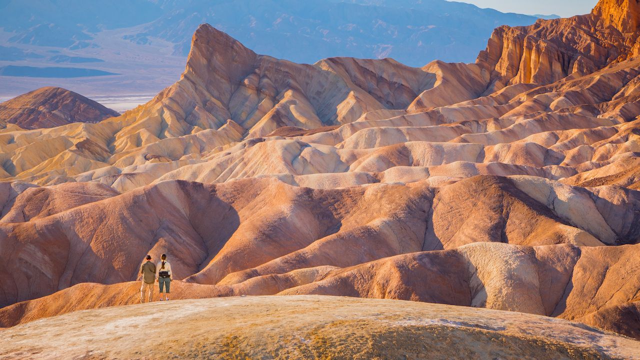 Couple-of-hikers-in-Death-Valley-National-Park-California Couple-of-hikers-in-Death-Valley-National-Park-California