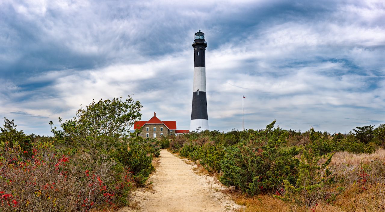 Fire-Island-Lighthouse-with-stormy-skies-and-colors-of-fall-foliage
